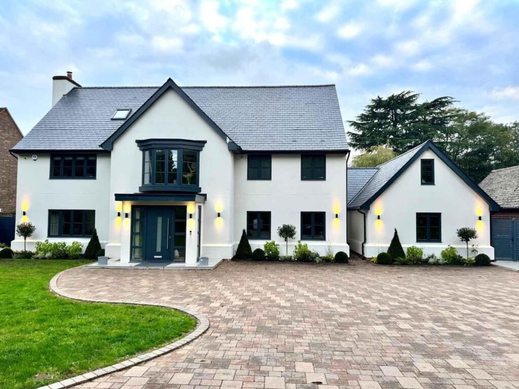 New build house in Cobham with front beds designed and freshly planted.